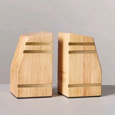 two pieces of wood sitting next to each other