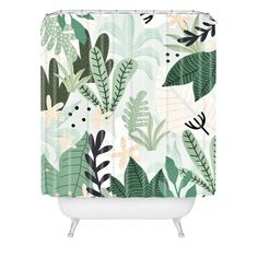 a shower curtain with green leaves and plants on the outside, in front of a white background