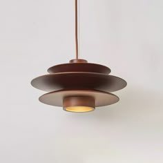 a modern light fixture hanging from a ceiling