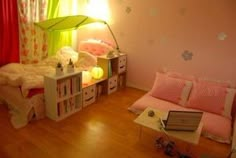 a bedroom with pink walls and wooden floors