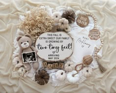 a baby announcement surrounded by teddy bears and other items