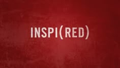 a red wall with the word inspired written on it