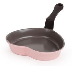 a pink and gray pan with a black handle on the side, sitting in front of a white background