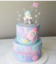 a birthday cake with a rocket and stars on it