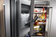 an open refrigerator with drinks and condiments on the door, in a kitchen