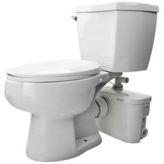 a white toilet sitting next to a trash can