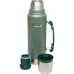 the stanley stainless steel water bottle is shown with its lid open and two cups next to it