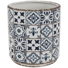 a blue and white vase with different designs on it