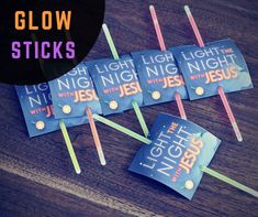 some stick candles are sitting on top of each other with the words glow sticks in front of them