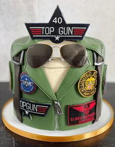 a cake that is shaped like an army uniform with patches and sunglasses on the top