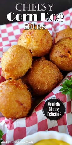 cheesy corn dog bites on a red and white checkered paper with dipping sauce