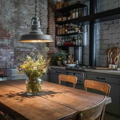 a kitchen with an old fashioned table and some chairs in front of the counter top