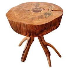 a wooden table with two antlers on it's legs and a white background