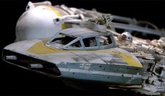 a star wars vehicle is shown with other vehicles in the background