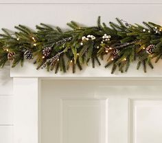 a christmas garland with pine cones and lights