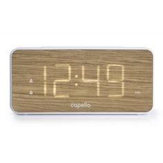 an alarm clock is shown with the time displayed on it's face and wood grained surface