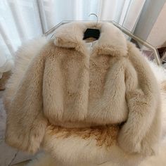 Wrap up in plush softness with this statement faux fur coat. Its indulgently cozy texture instantly elevates winter looks with luxe appeal. 🤍 Oversized polo collar 🤍 Front button closure 🤍 Side pockets Details- Thick. extra soft faux fur - Straight fit - Heavyweight feel- Available in beige For effortless chic with a couture feel. envelop yourself within this fuzzy faux fur coat. The oversized collar and roomy silhouette keep the focus on its lavishly textured fabrication.Size up for an ultra-cozy oversized blanket coat effect. Make a seriously sophisticated style statement while staying snug as can be. Care- Dry clean recommended - Avoid heat Faux Fur Coat For Cold Weather, Scandi Girl Style, Beige Faux Fur Coat, Shaggy Faux Fur Coat, Womens Faux Fur Coat, Coat Street Style, Blanket Coat, Oversized Blanket, Collared Coat