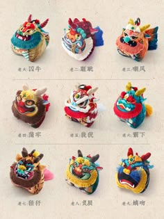 eight different types of dragon head brooches in various colors and sizes, all with chinese characters on them