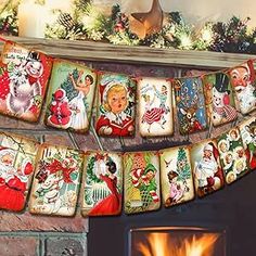 a christmas garland hanging over a fireplace next to a fire place