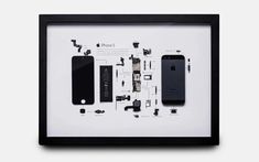 an iphone is shown in a black frame with parts removed from the back and inside