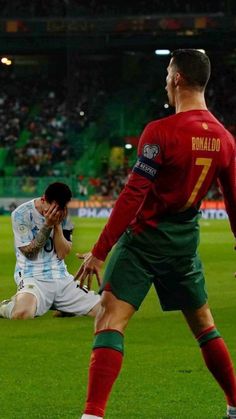 two men are playing soccer on the field