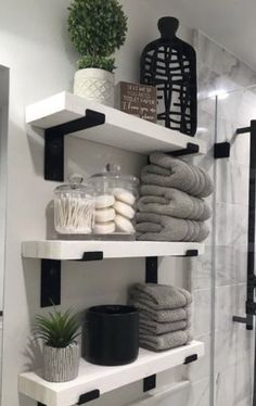 the shelves in this bathroom are filled with towels, soaps and other things to use