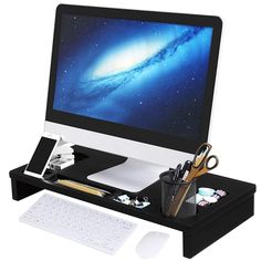 an apple desktop computer sitting on top of a wooden desk next to a keyboard and mouse