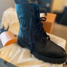 These Limited Boots From Louis Vuitton Are Gorgeous! Black Leather, With The Classic Lv Monogram And A Lug Sole. These Boots Are In Excellent Used Condition, Only Worn 3 Times. Very Light Creasing On The Toe Caps. Boots With Come With Individual Louis Vuitton Dust Covers, And Pouch With Additional Laces. Louis Vuitton Timberland Boots, Lv Laureate Boots, Luxury Leather Moto Boots With Front Lace-up Fastening, Louis Vuitton Black Shoes, Louis Vuttion Combat Boots, Ranger Boot, Shoes Louis Vuitton, Lv Monogram, Moto Boots