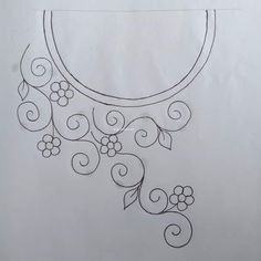 a drawing of a circular mirror with flowers and vines on the outside, hanging from it's side