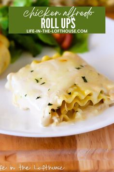 a white plate topped with lasagna covered in cheese