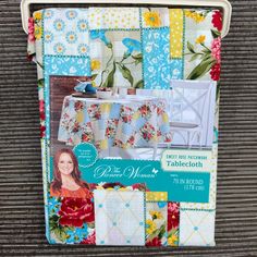 a table cloth with flowers on it and a flowered tablecloth in the middle