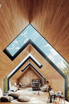 the inside of a house with wood floors and skylights on the ceiling is shown