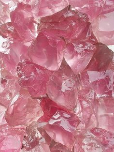 pink crystals are piled on top of each other