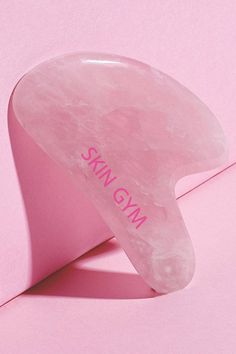 This heart shaped gua sha tool is a beauty essential that helps contour your face and depuffs skin. Check out our website for more beauty essentials! Gua Sha Pink, Metal Gua Sha, Gua Sha Metal, Gua Sha Tools Shapes, Guasha Rose Quartz, Dry Body Brushing, Ancient Beauty