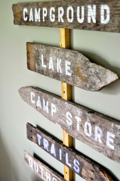 a wooden sign that says campground, lake and camp store trails attached to the wall