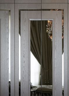 an image of a bedroom with mirrored doors