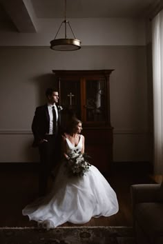 the bride and groom are posing for a photo