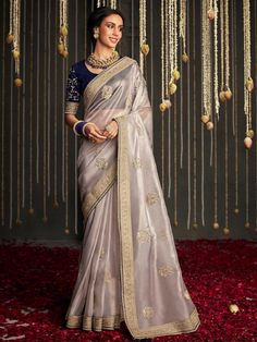 Presenting Graceful And Elegant Silks In Alluring Combinations. The Saree And Blouse Combo Is Embroidered And Also Has Woven Motifs To Add The Traditional Touch. Pair It With Jhumkis And Traditional Jewelry To Bring The Charm Out. Thank Us Later For All The Compliments You Get Silver Silk Woven Design Saree With Blouse Saree Saree Fabric : Silk Saree Color : Silver Saree Work : Woven Design And Embroidery Saree Meter: 5.5 Mtr Saree Width : 1.5 Mtr Blouse Blouse Fabric : Raw Silk Blouse Color : Blue Blouse Type : Unstitched Blouse Meter : 1.5 Mtr Care Instructions: 1. Do Not Machine Wash Or Hand Wash 2. Incase Of Stains, Immediately Wipe-Off The Stain With Cold Water 3. It Is Advised To Only Dry Clean 4. Do Not Keep It Bundled Up 5. Keep Away From Direct Sunlight Note: Product Color May Sli Silver Saree, Gold Silk Saree, Saree Work, Design Saree, Organza Silk Saree, Designer Silk Sarees, Blouse Saree, Silver Silk, Party Kleidung