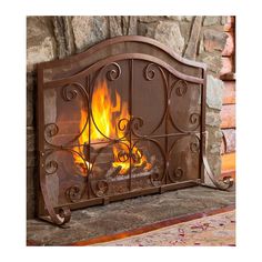 an iron fireplace screen with flames in it