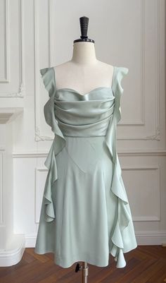 Elevate your allure with our Sage Green Satin Mini Dress. Crafted to captivate, its satin fabric drapes luxuriously, while the subtle hue exudes sophistication. Perfect for any occasion, it radiates timeless elegance with a modern twist. Cute Mint Green Dress, Gaun Hijau Sage, Pre-draped Green Evening Dress, Elegant Green A-line Satin Dress, Pre-draped Satin Mini Dress For Cocktail, Green Pleated Bodice Satin Dress, Green Draped Evening Dress, Green Satin Dress With Pleated Bodice, Elegant Green Ruched Mini Dress