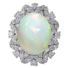 an opalite and diamond ring, by van cleef in the early 20th century