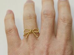 This stunning Twisted Rope bow knot ring is a perfect combination of elegance and charm. Handcrafted with care, this dainty bow tie ring features a delicate design in vermeil and sterling silver, adding a touch of sophistication to any outfit. Whether you're treating yourself or searching for a thoughtful friendship or birthday gift, this bow ring is sure to be a cherished addition to any jewelry collection. Celebrate special occasions with this timeless piece that symbolizes love and friendship Delicate Butterfly Knot Jewelry As Gift, Dainty Jewelry With Ribbon For Wedding, Gold Wedding Jewelry With Butterfly Knot Detail, Dainty Gold Jewelry With Ribbon, Adjustable Bow Jewelry For Anniversary, Gold Jewelry With Butterfly Knot For Gift, Delicate Butterfly Knot Jewelry For Gifts, Delicate Bow Jewelry As Gift, Dainty Ribbon Jewelry For Gifts