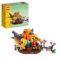 a lego box with an orange bird and other toys in it next to a toy figurine