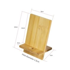 a wooden stand with a hole in the middle and measurements for it to be placed on