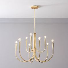 a gold chandelier hanging from the ceiling