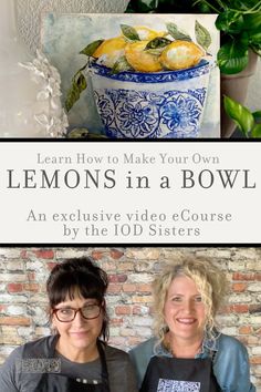 two women standing next to each other in front of a bowl with lemons on it