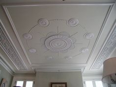 the ceiling in this living room is painted white