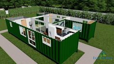 two green shipping containers sitting on top of a lush green field