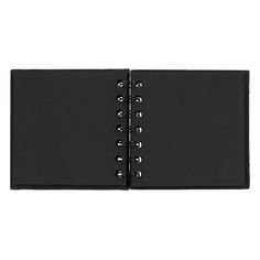 an open black notebook on a white background