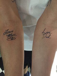 two people with matching tattoos on their arms